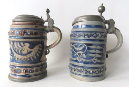 Two Westerwald cylindrical tankards with pewter lids, 18th century. The first with 2 narrow bands