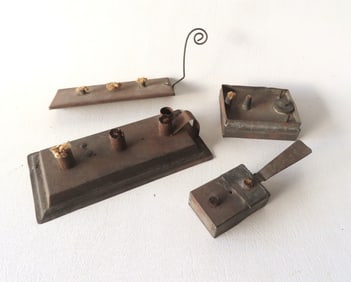 Four early miniature tin fat burning lamps, 18th/19th century. The one in rectangular shape with the