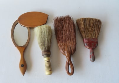 A make do folk art hand held wooden mirror with swivel cover, together with 3 whisk brooms, one with