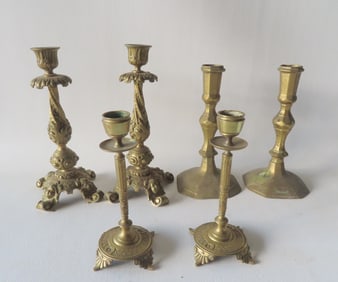 Three pair of vintage continental brass candlesticks including a pair in heavy brass with an