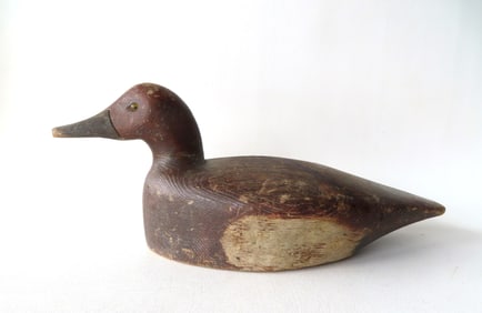 A Redhead duck decoy with glass eyes and with detailed sponge painted feathering across the back.