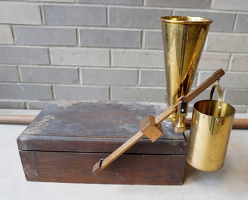 A Fairbanks brass chondrometer in original oak box, used for measuring and grading grain and oats.