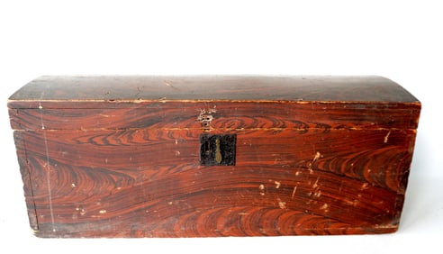 A grain painted dome top box in original red/black paint, dovetailed frame, mid 19th century.