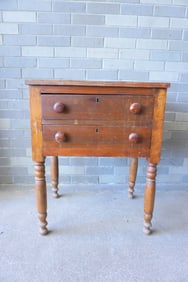 A Sheraton poplar wood 2 drawer stand with original grain painted Bennington pulls, circa 1830, the