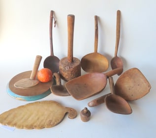 Grouping of early country treenware including a burlwood mallet, 2 serving ladles, 5 butter paddles