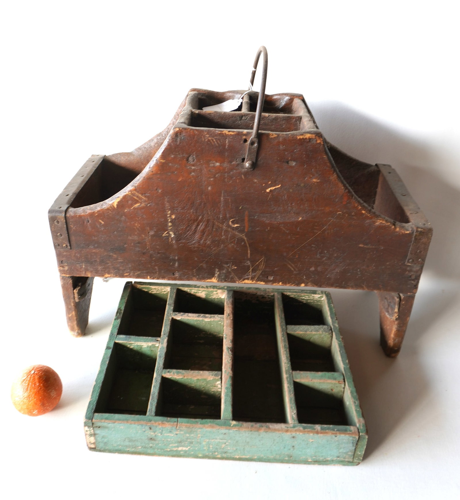 Two primitive farrier's hand carry tool trays, early 19th century. Both with expected use wear and: Two primitive farrier's hand carry tool trays, early 19th century. Both with expected use wear and good condition, the smaller in old green paint. The largest measures 23 1/2"W x 10 1/8"D x 20"H. Prov