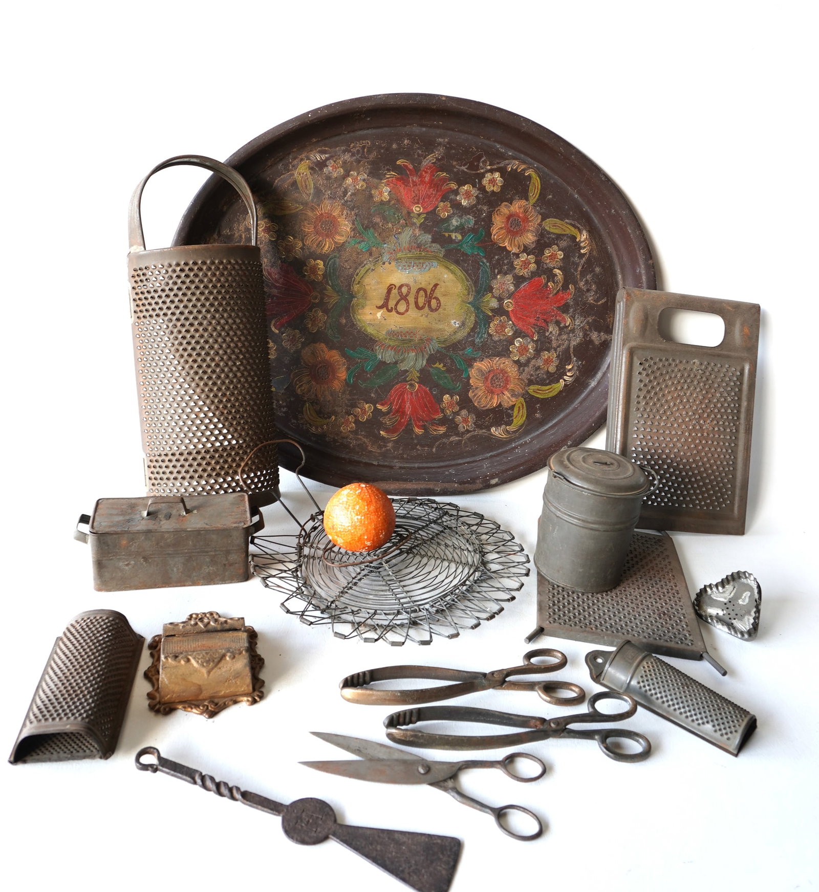 A large grouping of mostly kitchen collectibles in tin and iron, see photos for more details. All: A large grouping of mostly kitchen collectibles in tin and iron, see photos for more details. All believed to be 19th century. The largest is the hand painted toleware tray decorated with flowers and 