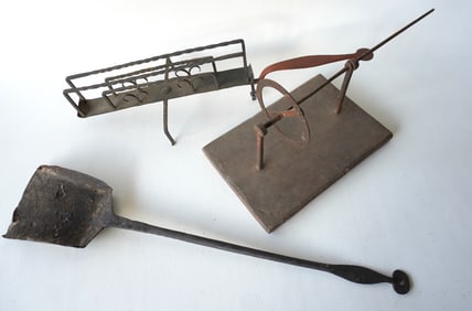 Three early hand forged iron tools, 18th/19th century. A very fine iron revolving toaster - very