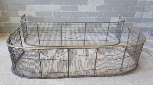 Two 19th century fireplace screens, wire fronts with brass tops. The one with wire swags, circa