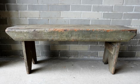 A primitive bench with see-through mortise construction and bootjack ends, circa 1800 - extensive