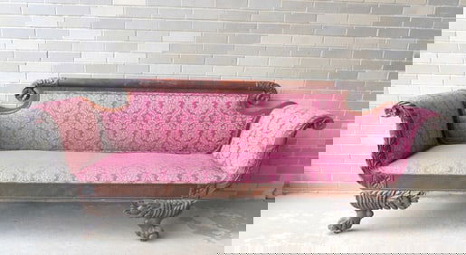 A classical mahogany Federal sofa, with rolled crest having ends terminating with acanthus carving