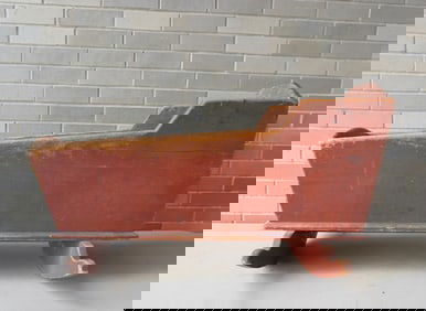 A primitive wooden cradle in original red paint. Some use wear, but overall good condition, early to