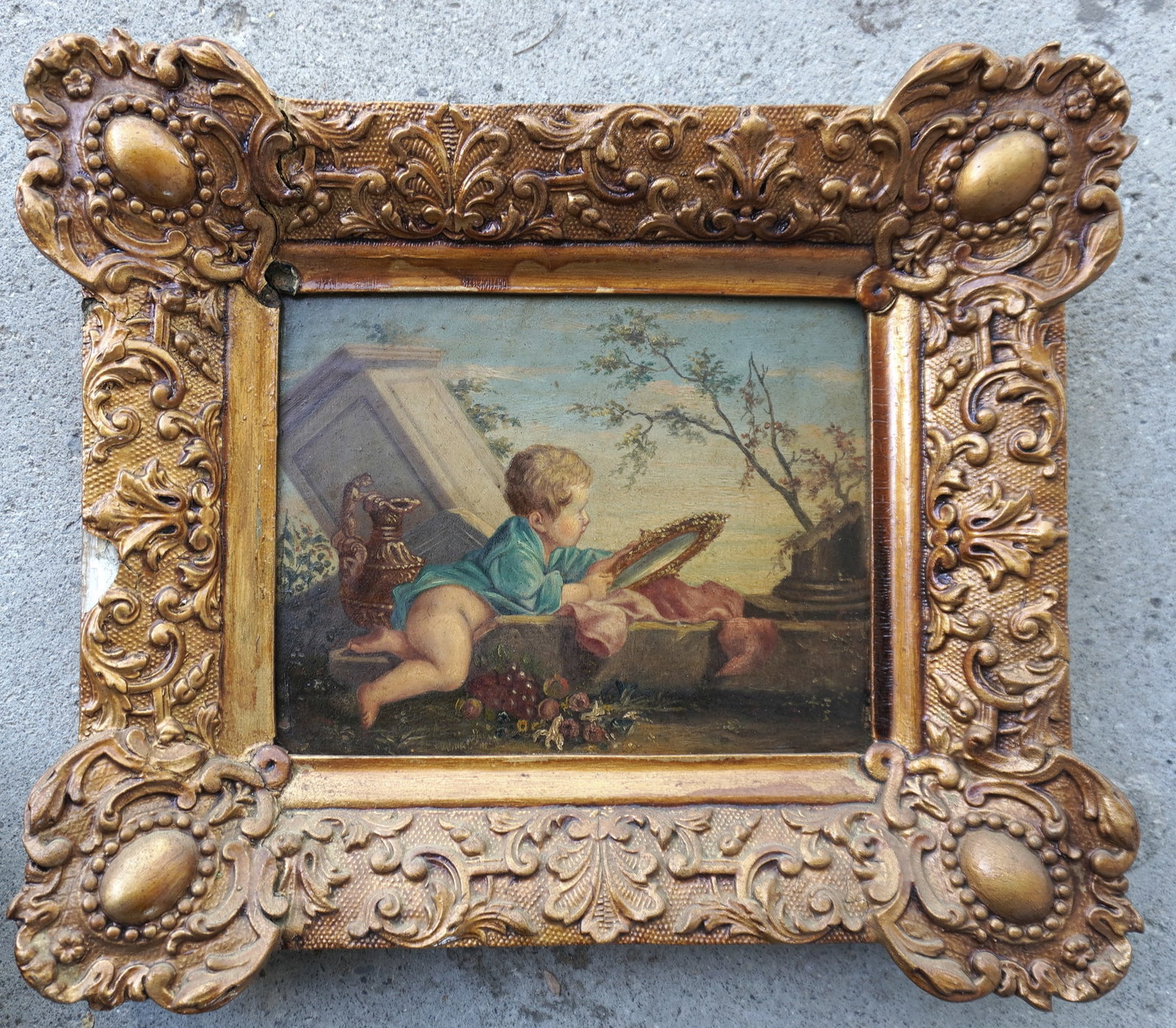 O/B Classical scene with crawling child looking at himself in mirror in crumbled building outdoor: O/B Classical scene with crawling child looking at himself in mirror in crumbled building outdoor setting. Housed in original gilt gesso frame with small loss on the right border and darkening of varn