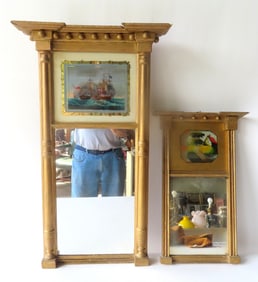 Two Sheraton double panel wall mirrors, circa 1820-30. The first with a reverse painting in upper
