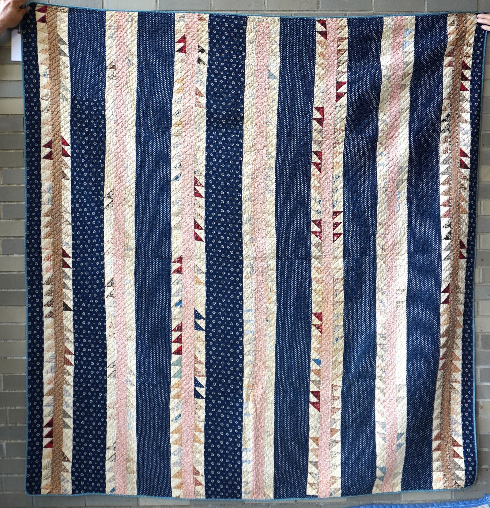 A Flying Geese pattern patchwork quilt, late 19th century - 72" x 75". Some wear and losses to: A Flying Geese pattern patchwork quilt, late 19th century - 72" x 75". Some wear and losses to patches and overall fair to good condition. Provenance: From the Marni Bakst and William Sadler collectio