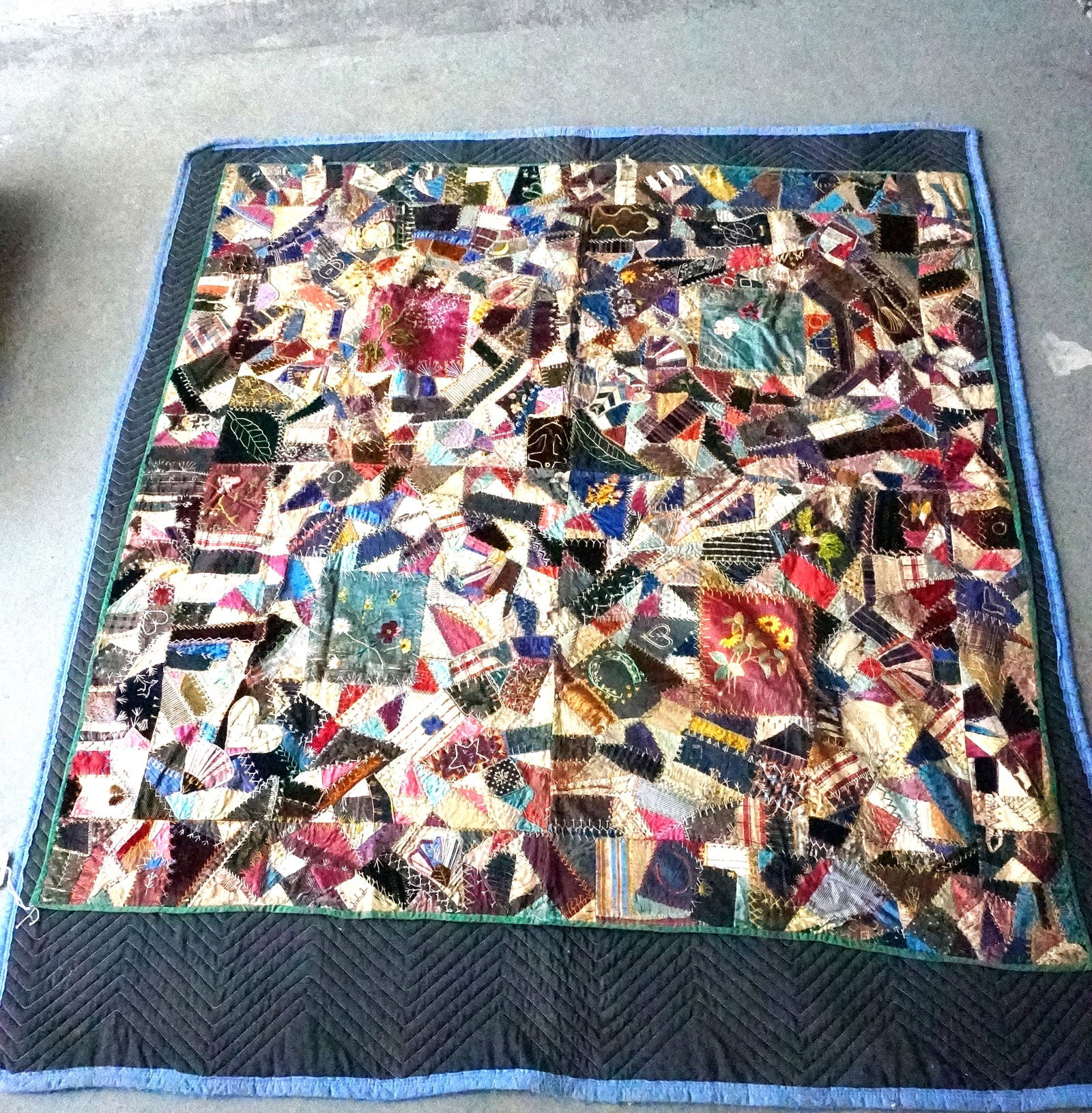 An exceptional 19th century crazy quilt, all hand sewn with fine embroidery work.: An exceptional 19th century silk and velvet crazy quilt, all hand sewn with fine embroidery work, including the date 1887. Decorated with a small horse, hearts, fans, insects, geometric, flowers, etc.