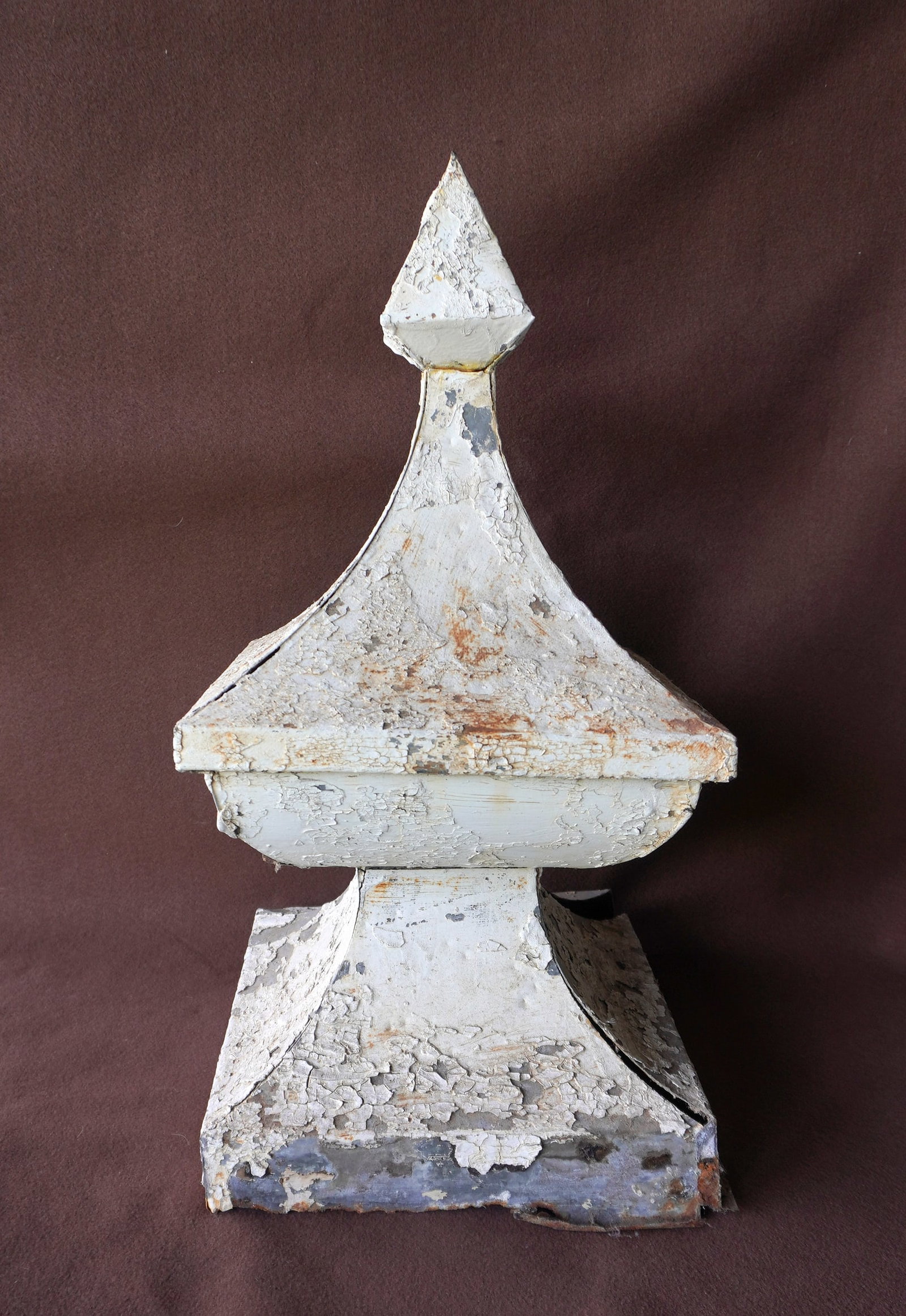 An architectural zinc building finial. Some separation of metal at seams, otherwise good condition.: An architectural zinc building finial. Some separation of metal at seams, otherwise good condition. Measures 24"H x 12" square at base.