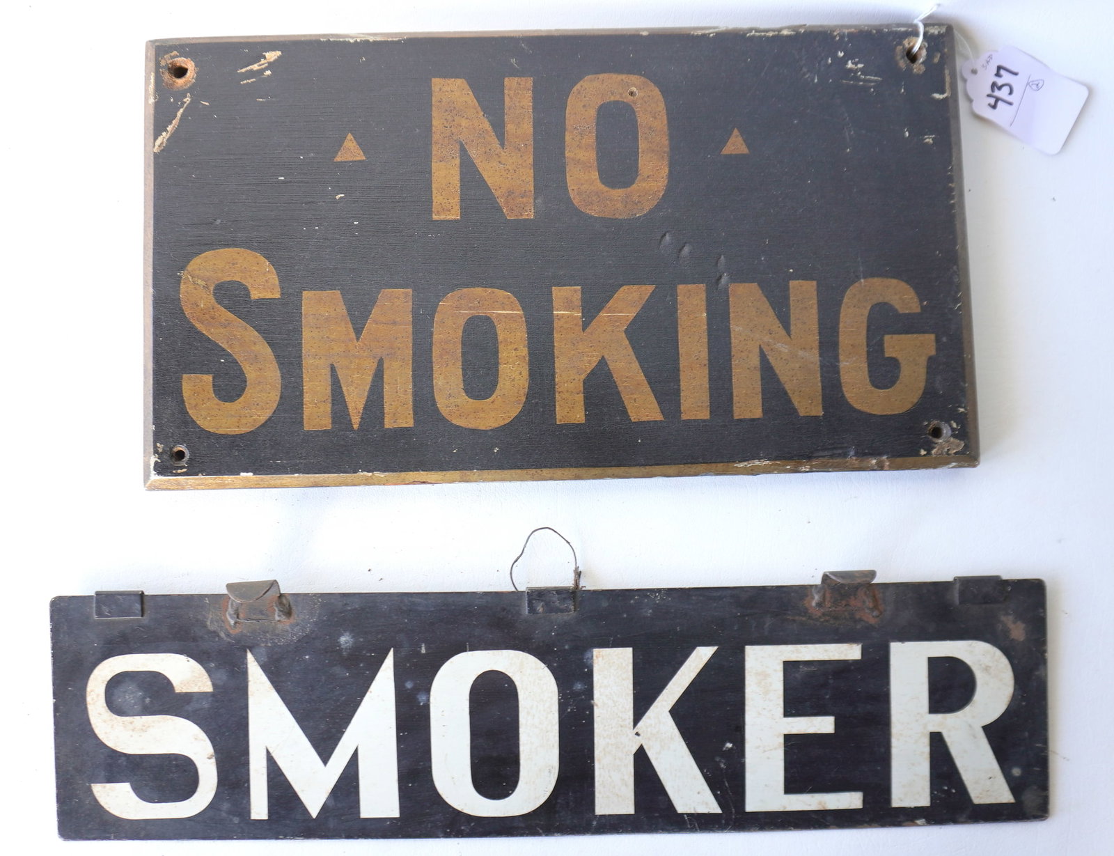 Two smoking related vintage signs. The first a double sided train or bus sign in black and white: Two smoking related vintage signs. The first a double sided train or bus sign in black and white marked "SMOKER" - good condition - 21 5/8"L x 5 3/8"H - circa 1930-40; and a single sided wooden sign m