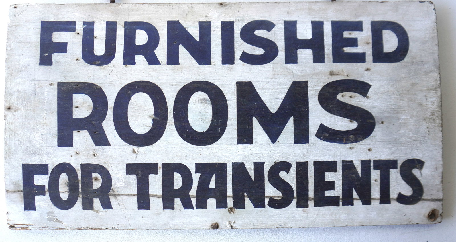 An unusual double sided, hand painted boarding house sign marked "FURNISHED ROOMS FOR TRANSIENTS",: An unusual double sided, hand painted boarding house sign marked "FURNISHED ROOMS FOR TRANSIENTS", black letters on white ground. Good condition, probably early 20th century. Measures 21 3/4"W x 12 3/