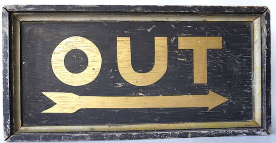 A good wooden sign marked "OUT" with painted directional arrow, gold lettering on black ground. The