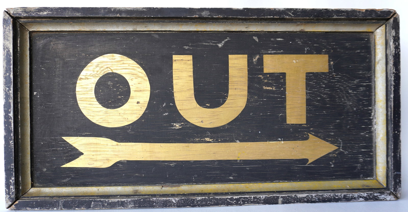 A good wooden sign marked "OUT" with painted directional arrow, gold lettering on black ground. The: A good wooden sign marked "OUT" with painted directional arrow, gold lettering on black ground. The molded wooden frame in black and silver - normal paint wear and overall good condition, circa 1900. 