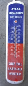 A vintage lithographed tin advertising thermometer marked "Atlas Perma-Guard Anti-Freeze" - minor