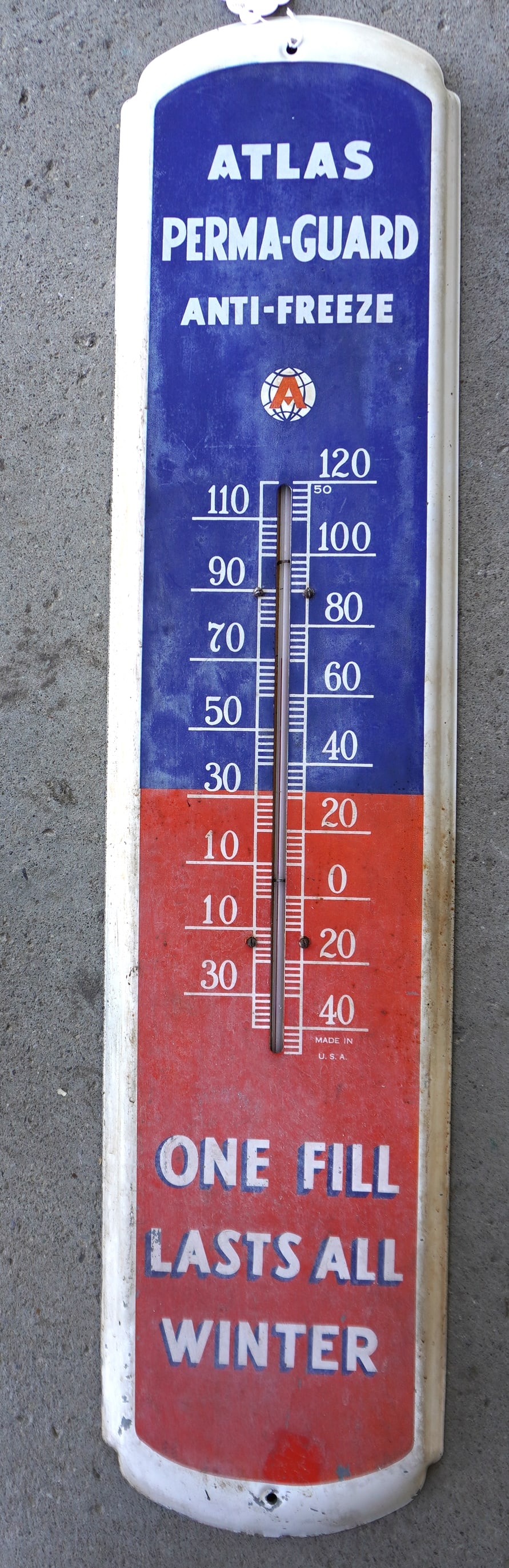A vintage lithographed tin advertising thermometer marked "Atlas Perma-Guard Anti-Freeze" - minor: A vintage lithographed tin advertising thermometer marked "Atlas Perma-Guard Anti-Freeze" - minor use wear, and overall good original condition. Measures 8"W x 35"H.