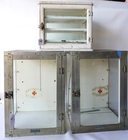 Three small table top medicine cabinets. The largest, 2 identical signed "Antiseptic Sterilizer" and