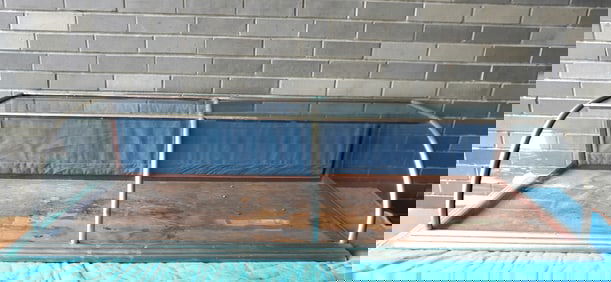 Large country store table top showcase with curved front, 2 sliding doors and nickel plated metal