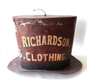 A large painted galvanized tin top hat trade store sign marked "HATS AND CAPS / RICHARDSON.