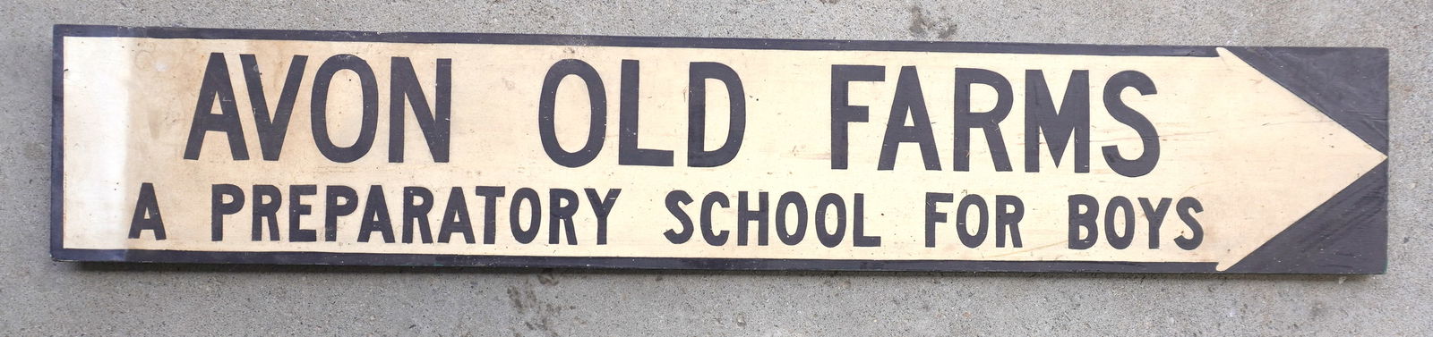 Wooden sign marked "AVON OLD FARMS / PREPARATORY SCHOOL FOR BOYS" painted on white ground arrow,: Wooden sign marked "AVON OLD FARMS / PREPARATORY SCHOOL FOR BOYS" painted on white ground arrow, circa 1950-70. Good condition. Measures 52"L x 9"H. Provenance: From the Marni Bakst and William Sadler