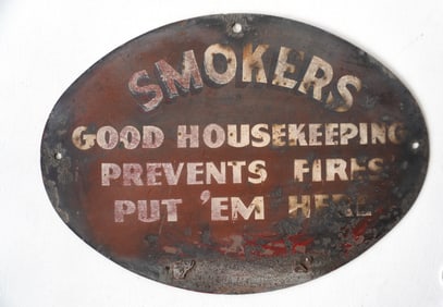 An oval iron smoker's sign in original paint, circa 1920's - some paint wear but overall good