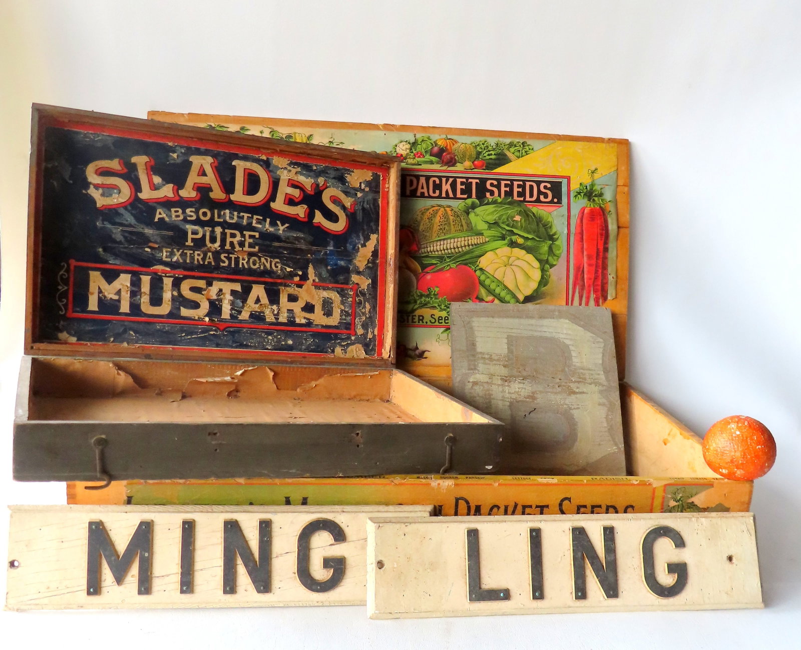 Grouping of 5 advertising articles including: "Slade's Mustard" box - losses to lithograph;: Grouping of 5 advertising articles including: "Slade's Mustard" box - losses to lithograph; "Webster's Mammoth Packet Seeds" box - the interior colored lithograph with losses bottom right corner- the 
