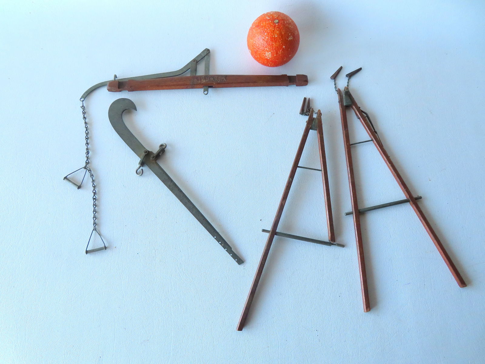 A rare salesman sample or patent model for a Fairbanks iron beam scale mounted on a swing-like: A rare salesman sample or patent model for a Fairbanks iron beam scale mounted on a swing-like walnut platform that attaches to cross bar with wooden wedges. One leg of the swing is broken and is miss