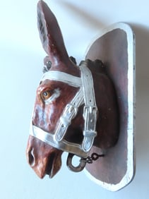 An advertising chalkware mule head for 20 Mule Team Borax cleaners, early 20th century, mounted on a