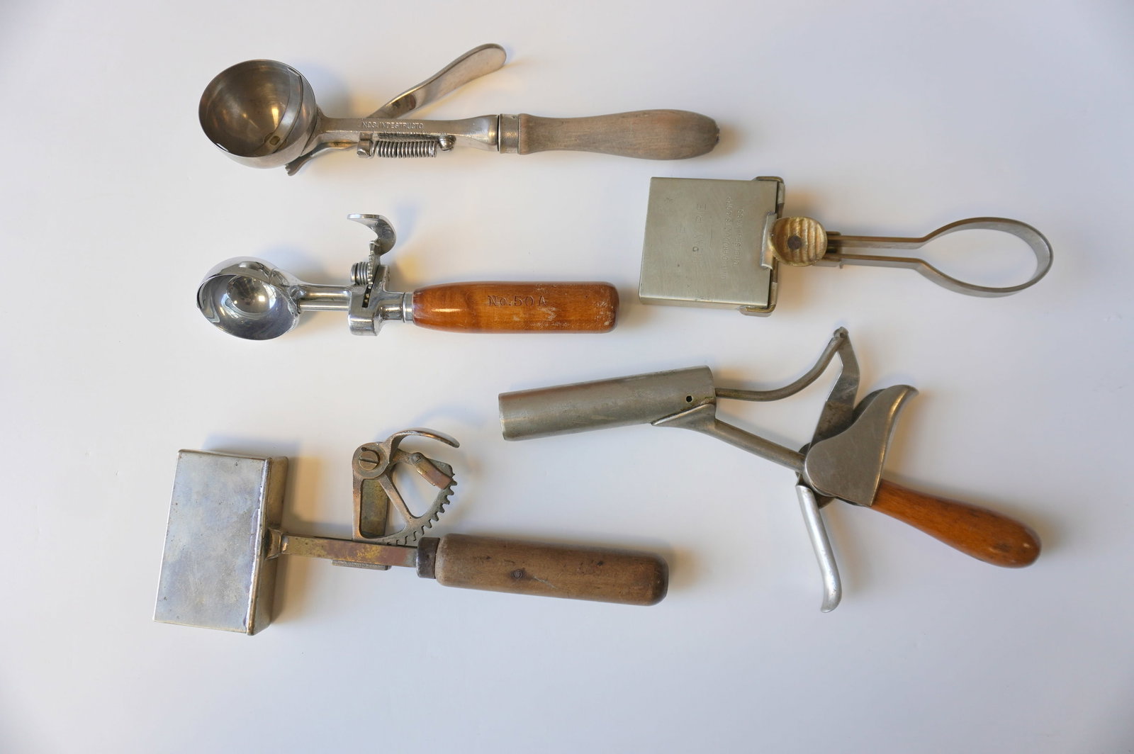 Grouping of 5 unusual vintage ice cream scoops - the largest, the pistol grip scoop, measures 11"L -: Grouping of 5 unusual vintage ice cream scoops - the largest, the pistol grip scoop, measures 11"L - non working condition, the others all in very good condition in working order. Provenance: From the