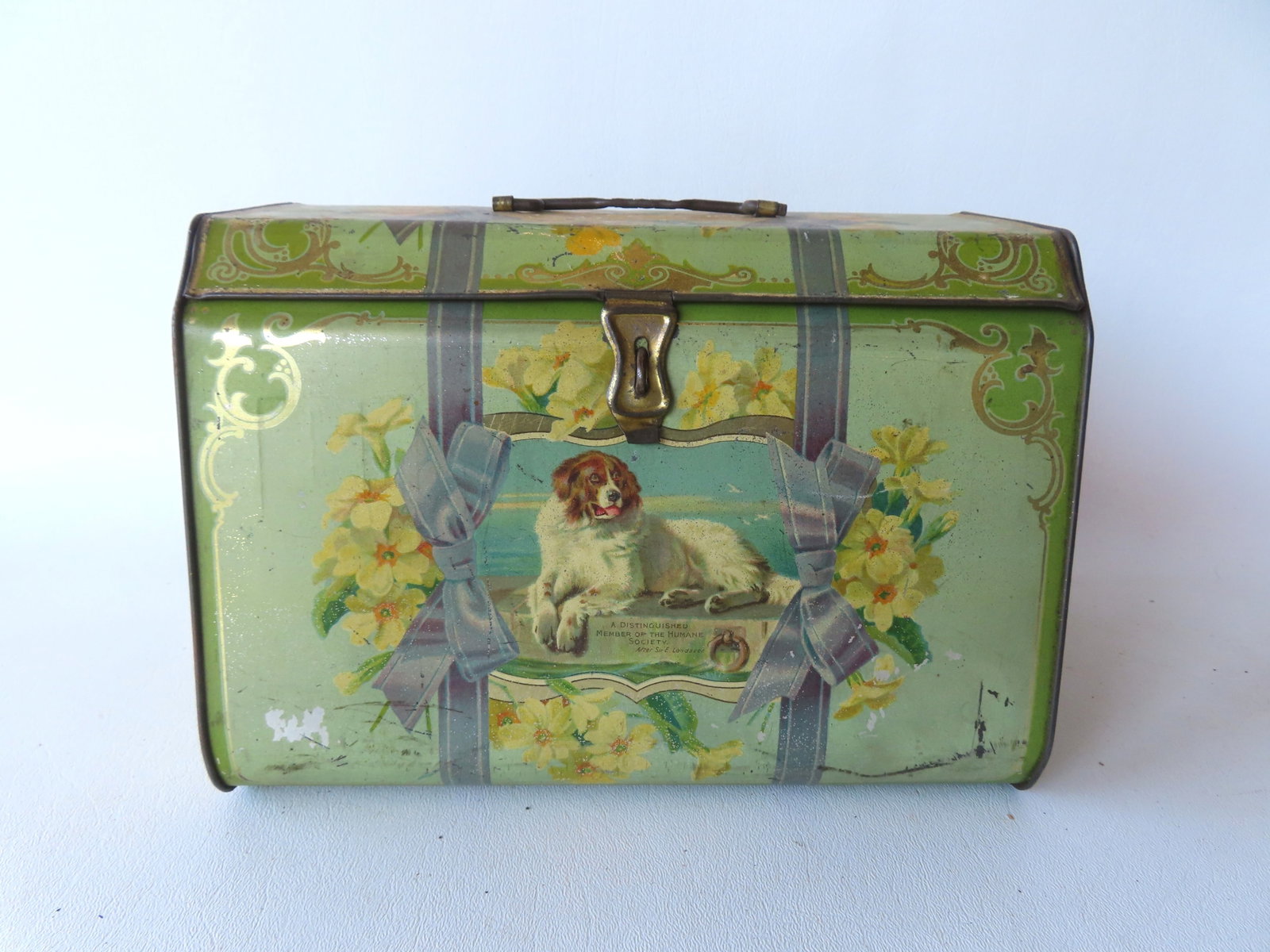 A Distinguised Member Of The Human Society lithograph biscuit tin decorated with dogs.: A Distinguised Member Of The Human Society lithograph biscuit tin decorated with dogs. The front panel after a painting by Sir Edwin Henry Landseer depicting a Newfoundland dog from 1831. The dog in t
