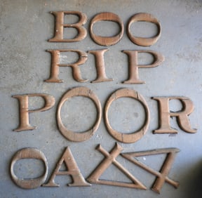 A grouping of 14 vintage wooden advertising sign letters in old gilding, plus other that are apart