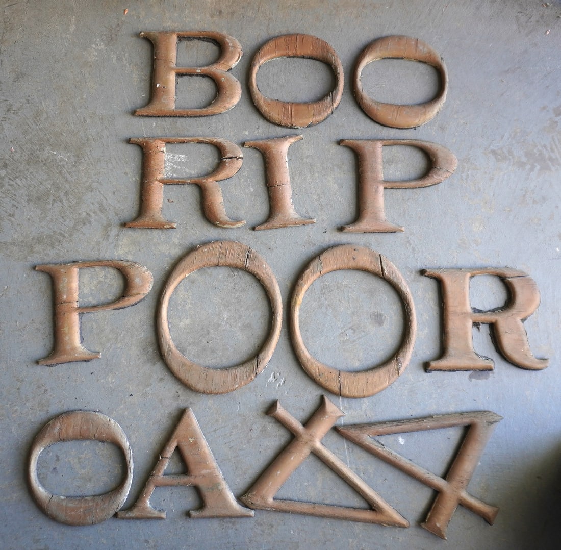 A grouping of 14 vintage wooden advertising sign letters in old gilding, plus other that are apart: A grouping of 14 vintage wooden advertising sign letters in old gilding, plus other that are apart and need to be glued together. Some of the 14 are with cracks, repairs, and may need fixing as well, 