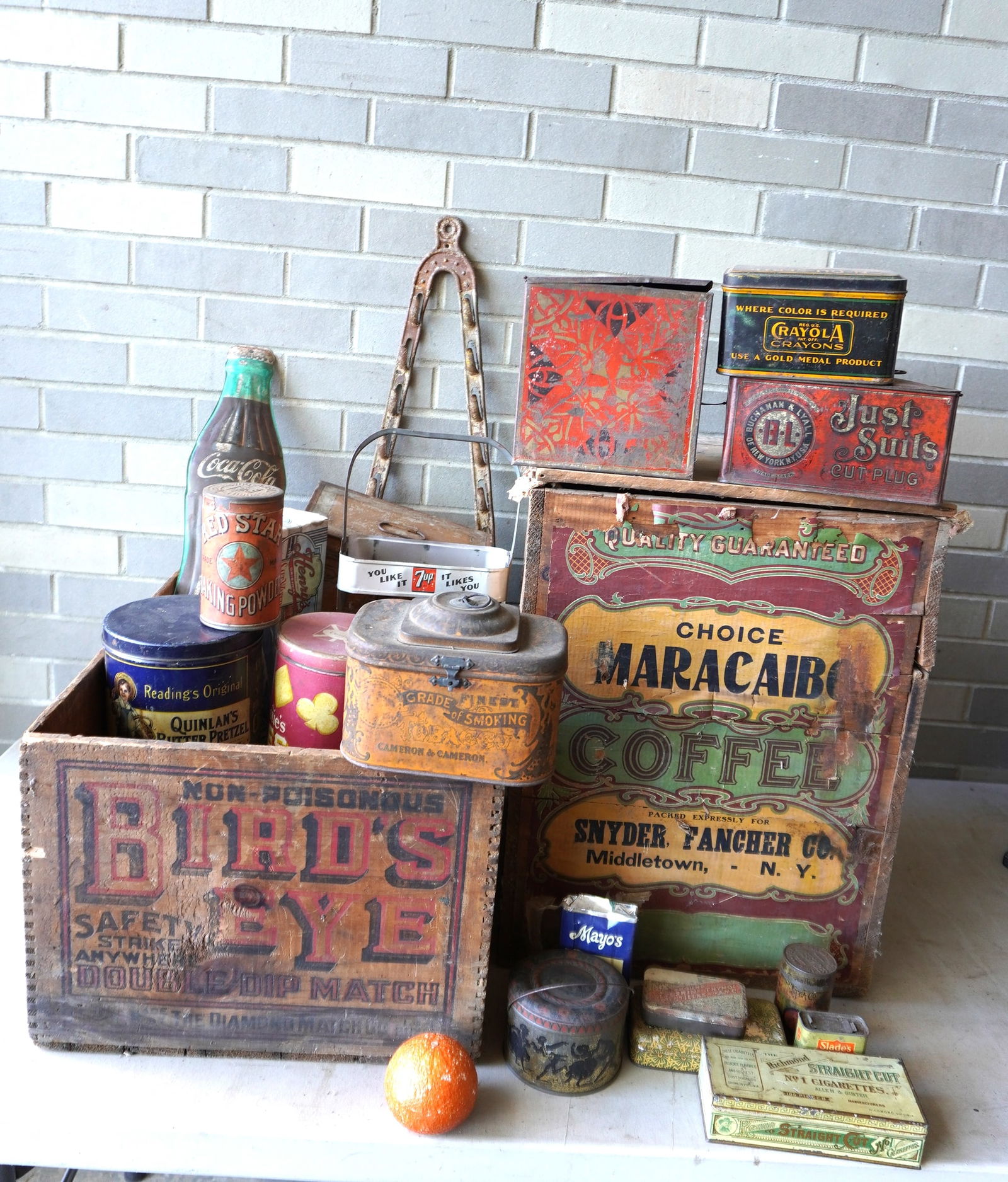 A large grouping of advertising tins and boxes, most early to mid 20th century, some local. Includes: A large grouping of advertising tins and boxes, most early to mid 20th century, some local. Includes a wooden coffee shipping crate for Choice Maracaibo Coffee, with paper label from Middletown NY - 1