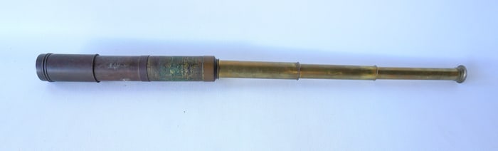 A brass telescopic ship's spyglass, 19th century. Tarnished, missing end cap for lens, otherwise