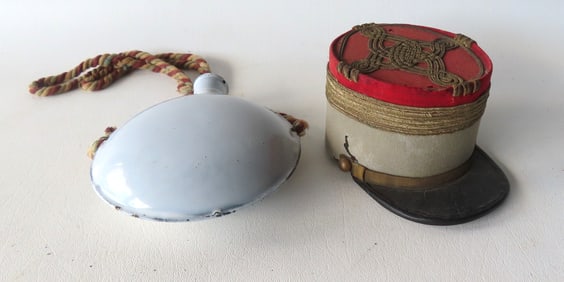 Two small military collectibles: The first a miniature French military kepi, circa 1900, either for