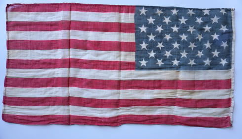 An American 39 star flag, measures 34 1/2"L x 18"W, good condition. The following credit Wikipedia: