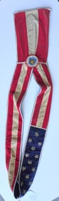 A Centennial patriotic parade sash circa 1876, with 13 applied gold sequin stars on blue velvet