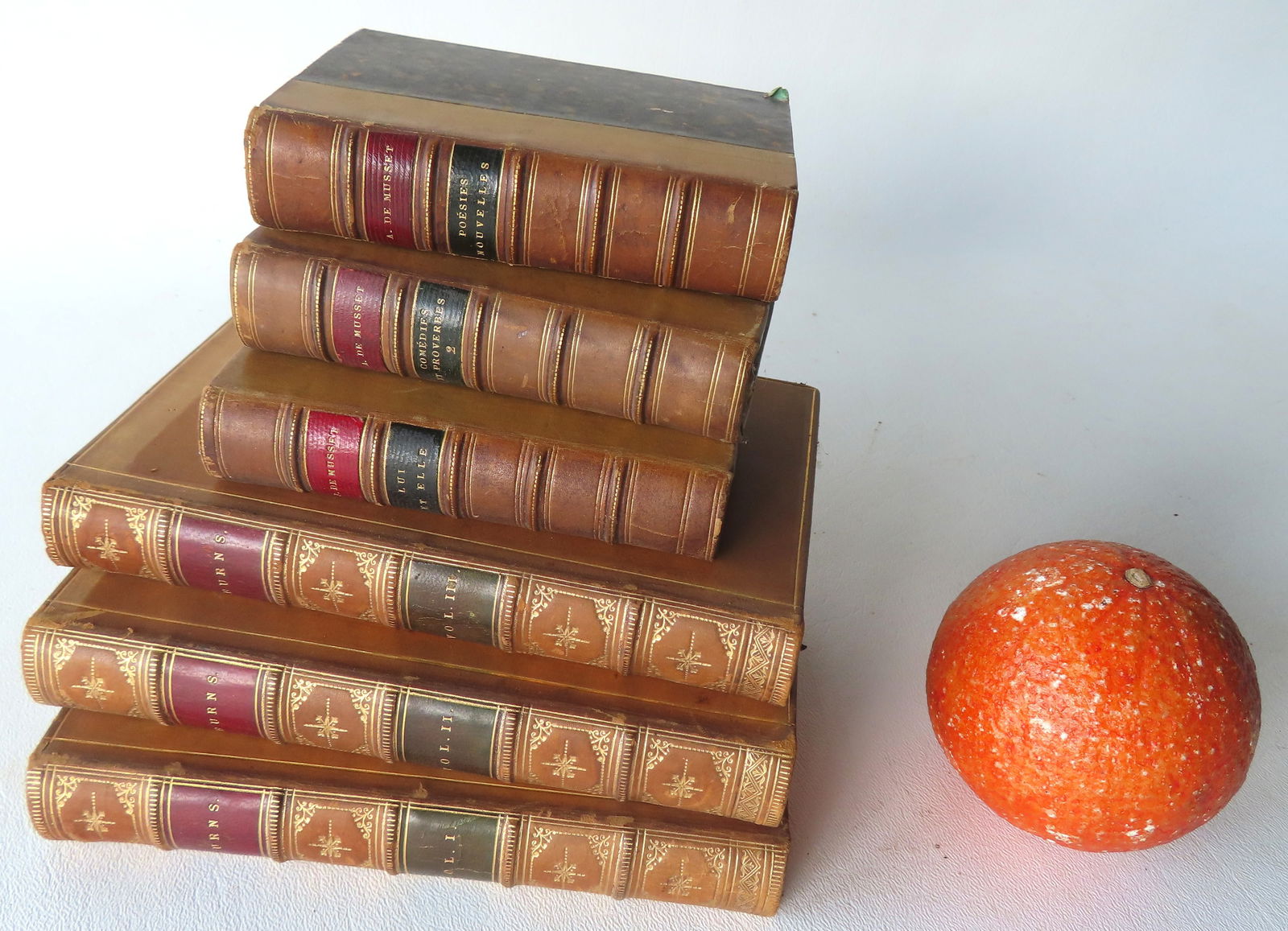 Two sets of 3 leather bound books, 19th century. The smallest, titled "Lui et Elle" by Paul De: Two sets of 3 leather bound books, 19th century. The smallest, titled "Lui et Elle" by Paul De Musset and published in Paris 1881 - very good condition; and the larger set, "The Poetical Works of Robe