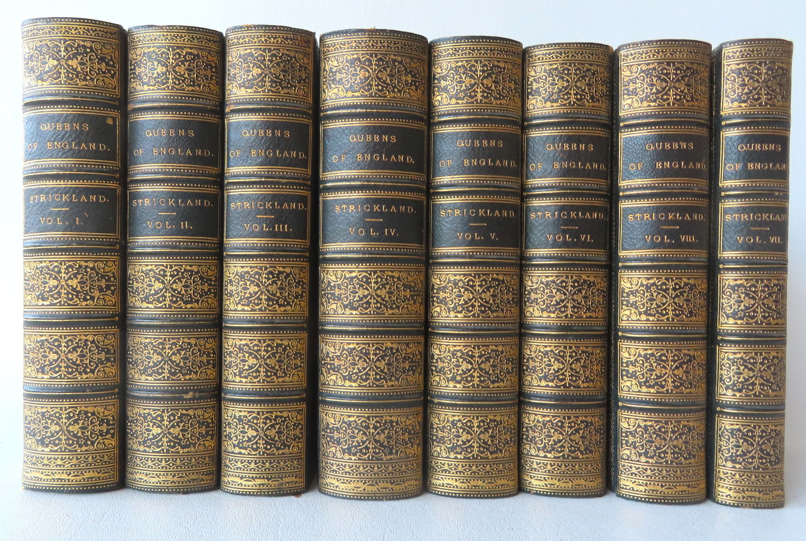 Eight outstanding leather bound volumes "Lives Of The Queens Of England From The Norman Conquest" by: Eight outstanding leather bound volumes "Lives Of The Queens Of England From The Norman Conquest" by Agnus Strickland, and published in London by Longmans, Green, Reader, & Dyer in 1873 - a New Editio