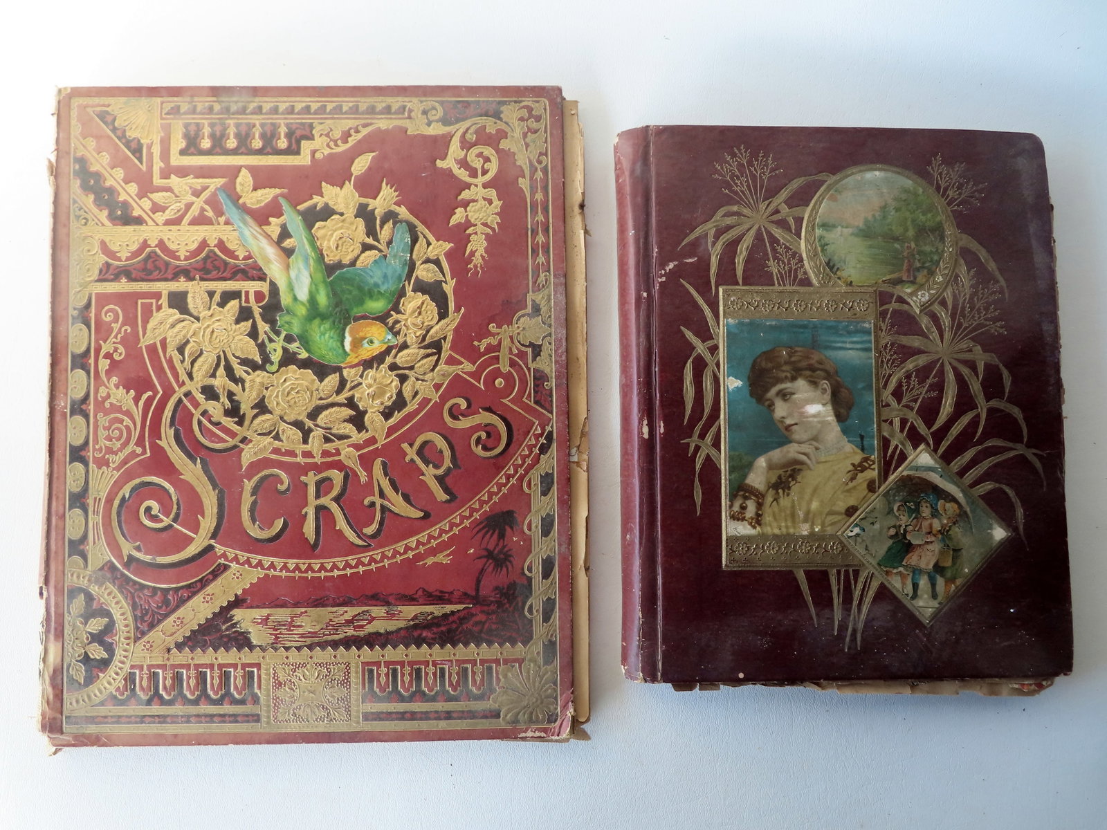 Two Victorian scrap books, one with mostly die-cuts, 20 double pages, and the other with mostly: Two Victorian scrap books, one with mostly die-cuts, 20 double pages, and the other with mostly trade cards, 14 double pages, both 19th century and in good condition. The largest book measures 11 1/2"