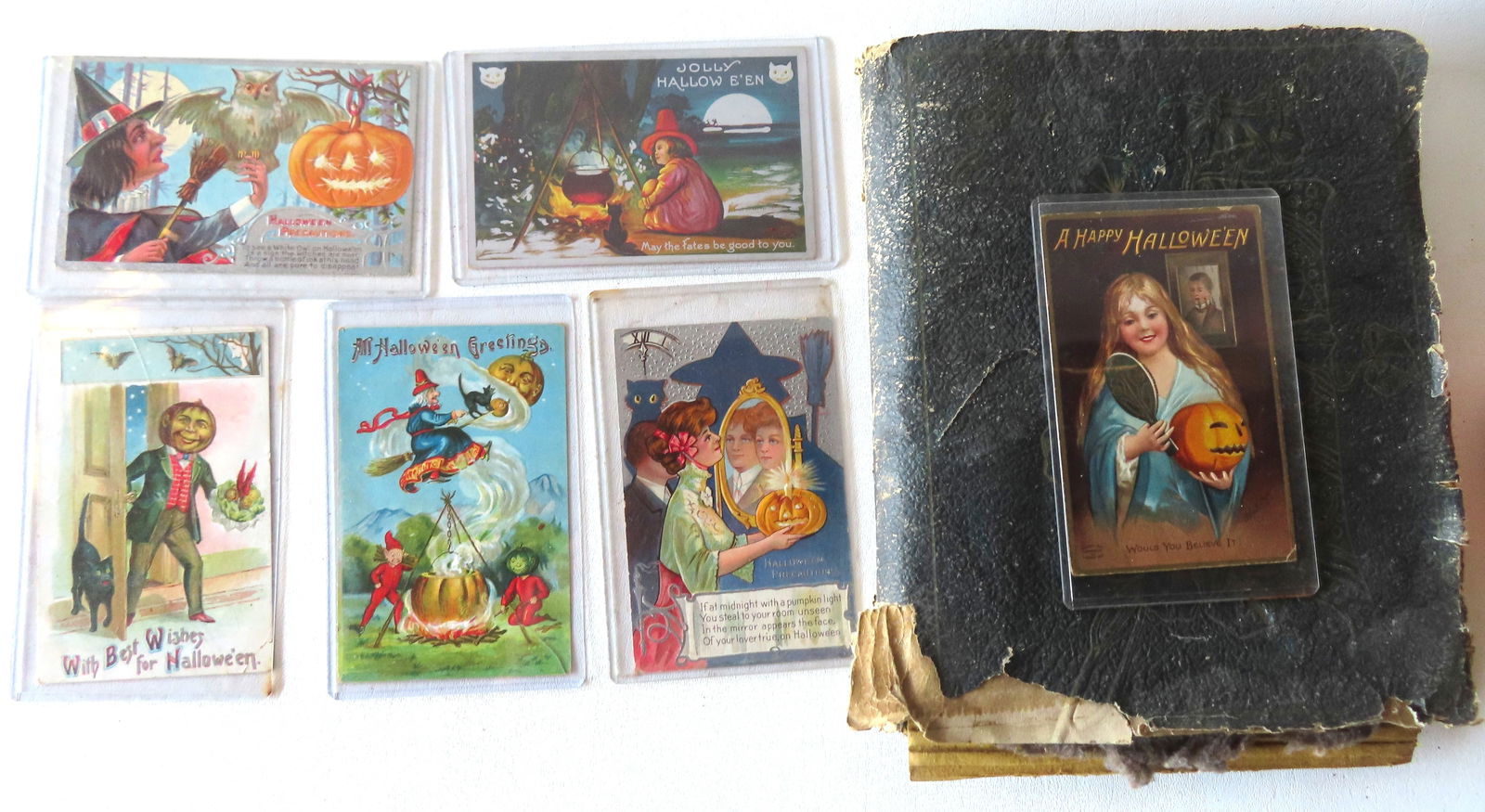 A vintage postcard album with 6 Halloween, many romantic Spanish American War, other romantics circa: A vintage postcard album with 6 Halloween, many romantic Spanish American War, other romantics circa 1900, 4 Hudson River Celebration including Robert Fulton, holidays, 3 steamship, 3 silhouette, etc.
