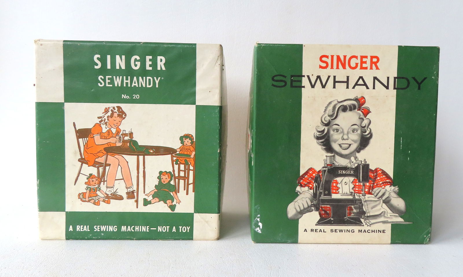Two Singer Sewhandy No. 20 little girl's sewing machines in original boxes. Please review photos for: Two Singer Sewhandy No. 20 little girl's sewing machines in original boxes. Please review photos for your own assessment of condition as they have not been tested but both appear in very good conditio