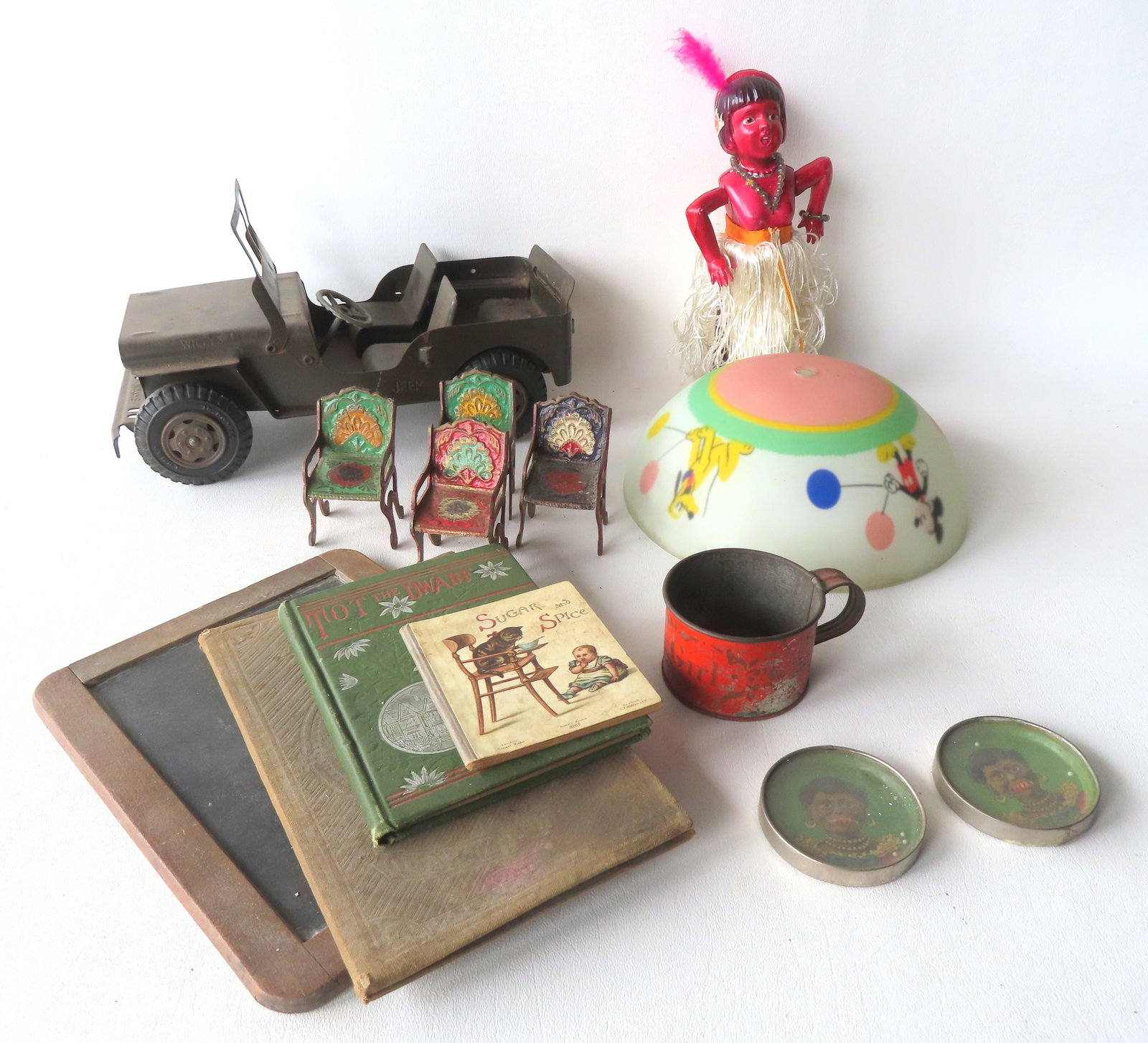 Grouping of vintage toys including: Celluloid windup dancing Indian doll - good working condition; a: Grouping of vintage toys including: Celluloid windup dancing Indian doll - good working condition; a Lumar pressed steel Willys Jeep - 11"L x 5 1/4"W - good condition; a Disney ceiling lamp shade deco